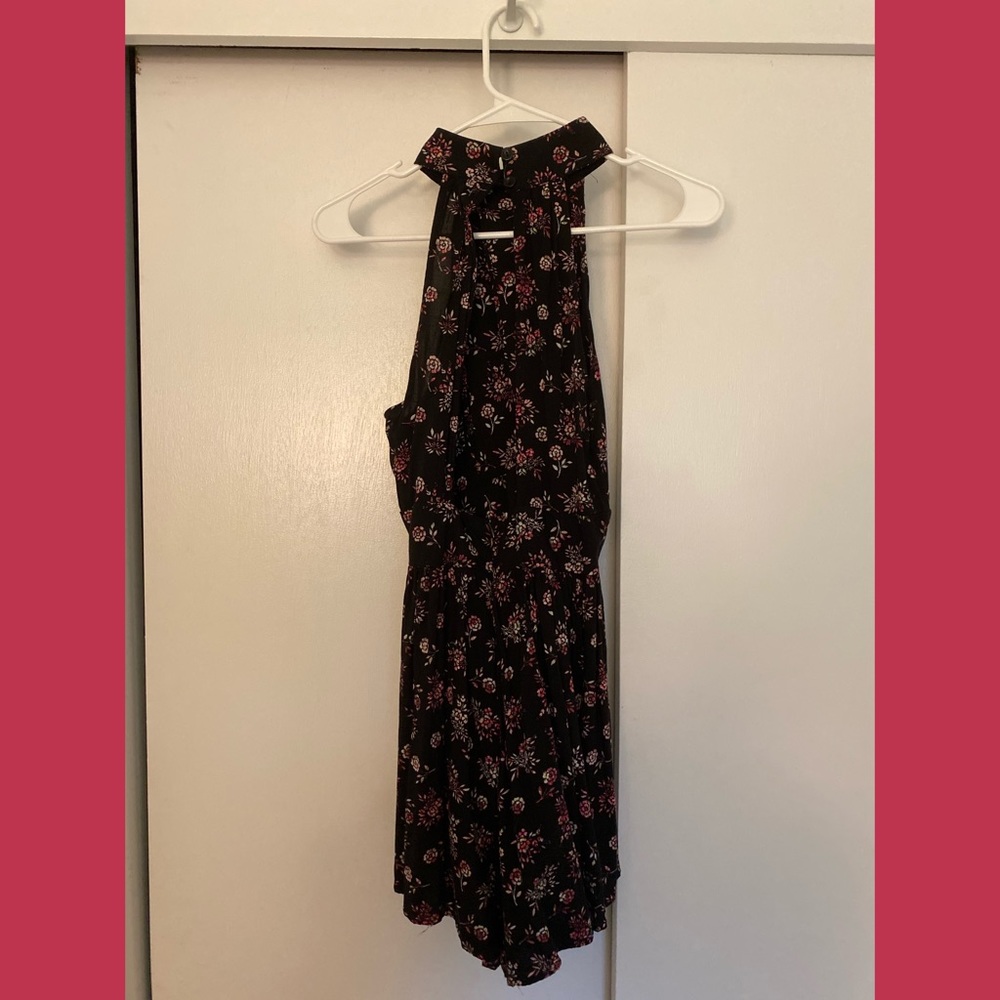 black flowy high neck romper with pink floral